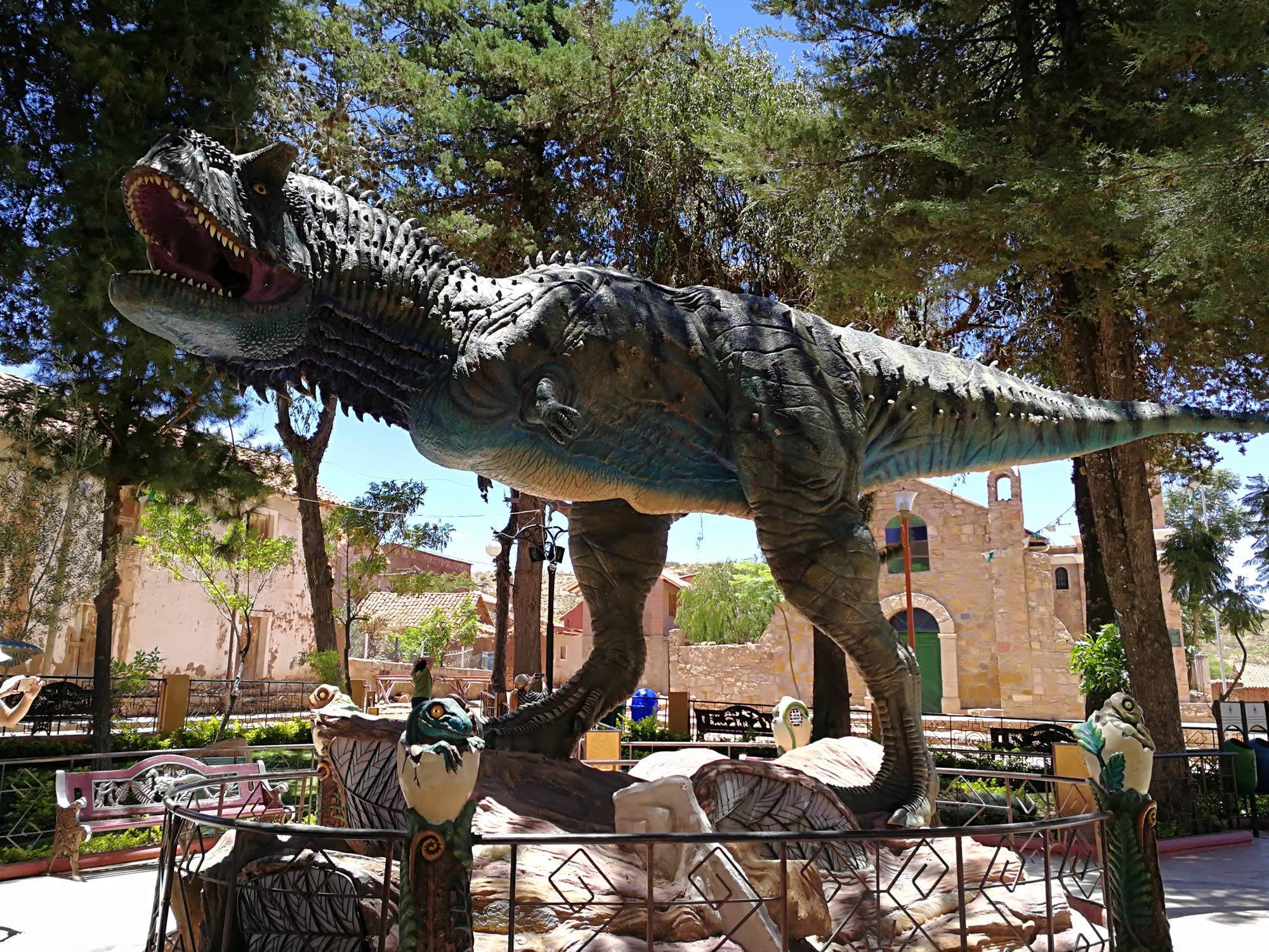 T-Rex dinosaur model at the park entrance